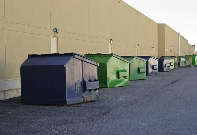 a stack of heavy construction dumpsters waiting to be emptied in Clovis